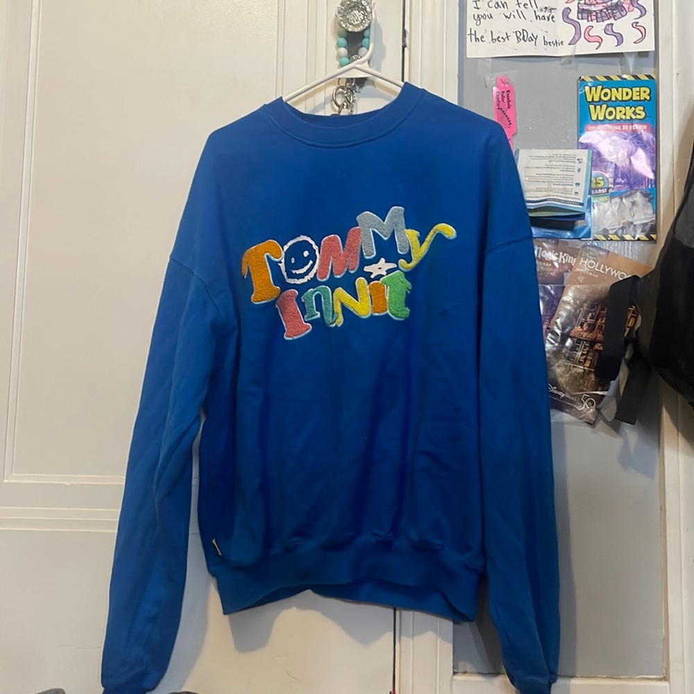 tommy innit unisex merch sweater.